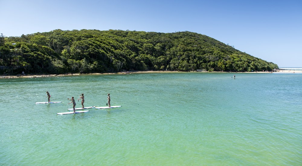 Try out stand-up paddleboarding at the calm waters of Seal Beach