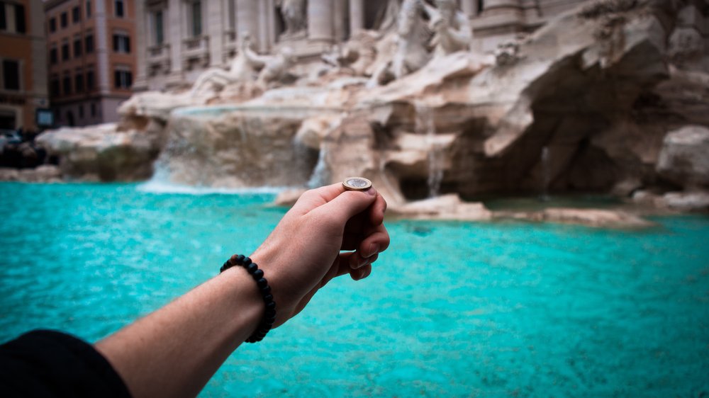 Marvel at the Trevi Fountain and toss a coin for good luck