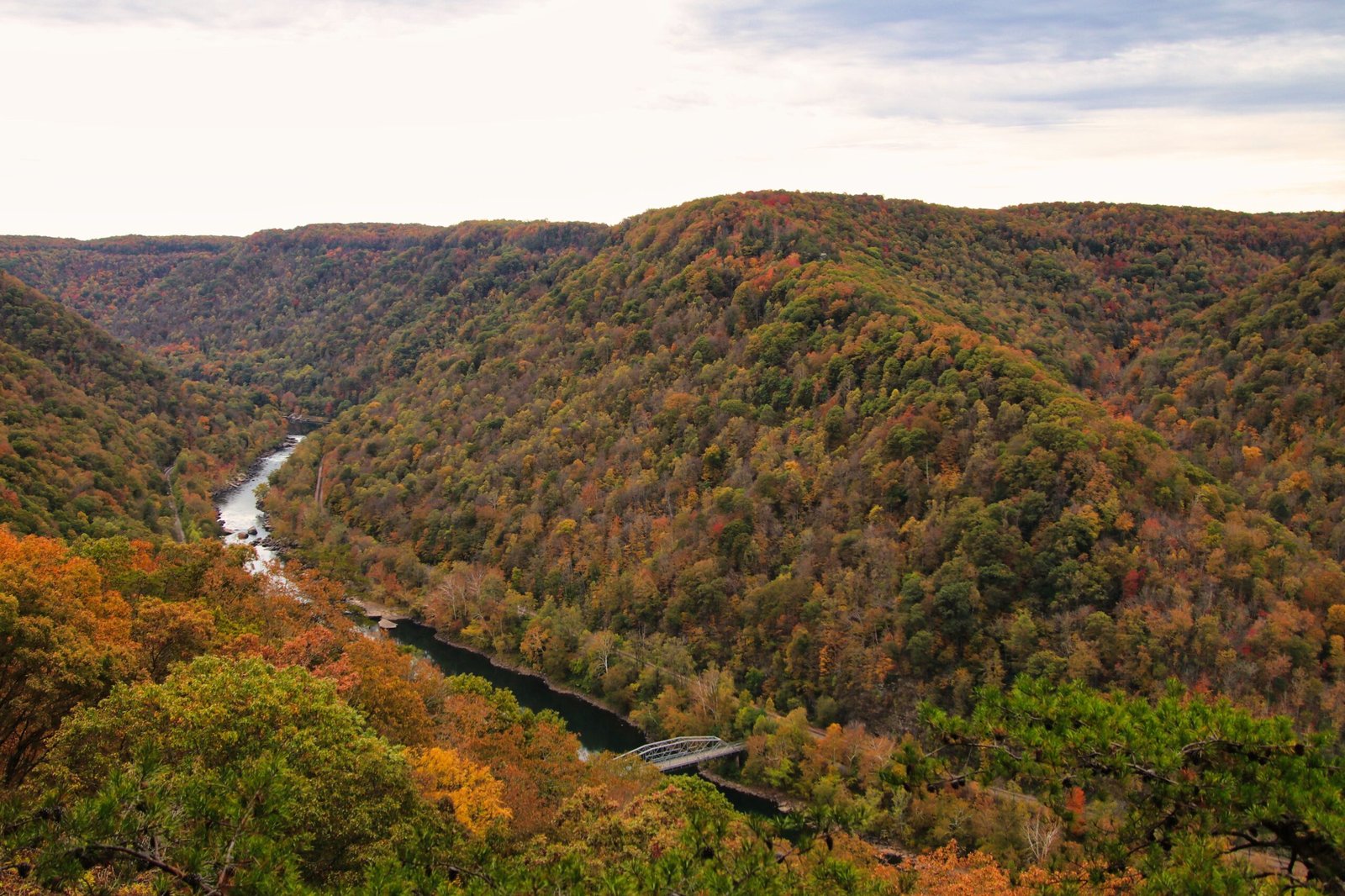 Hike the scenic trails at Quechee Gorge for stunning views of the gorge in fall colors